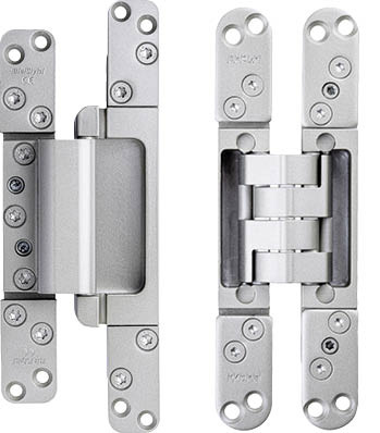 Links: Beim neuen „Masterband FX2 120 3-D FD“ (für Haustüren) liegen alle drei Justierarten – die seitliche Falzluft­justierung, die Höhenverstellung und der Anpressdruck der Dichtung – im Zargenteil des Bandes.Rechts: Beim neuen „Pivota DX 38 N 3-D“ (für Innen­türen) sorgt der ­größere Abstand der beiden Bandkörper zueinander&nbsp; dafür, dass das Band auf Flügel- und Zargenseite tiefer ins ­Material eingefräst werden kann. Das stabilisiert die Gesamtkonstruktion.