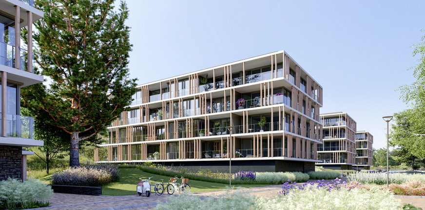 Die Gebäude von Finest of Ockenburgh bilden eine Einheit mit der grünen Umgebung, in der Dünen, Bäume und Strand dominieren.