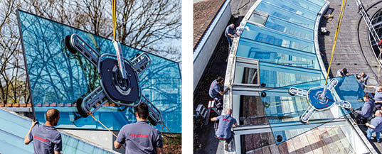 Verglasung des Foyers der Hans Alfred Keller Schule in Siegburg durch die Glaserei Merten. Die Scheiben trapezförmig wiegen zwischen 420 und 480 kg und sind zwischen 1,30 und 1,48 m breit und 4,20 / 4,30 m lang.