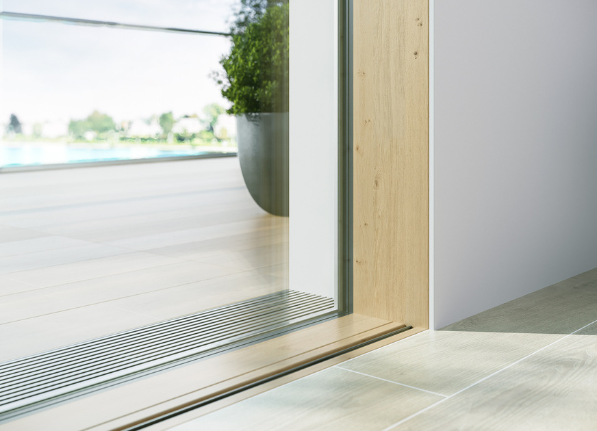 Der HS slim SKY axxent verfügt über eine 0-mm-Bodenschwelle mit Festverglasung in den Boden und ist dank der frei wählbaren Bodenschwellenfarbe optisch ausgesprochen dezent.
