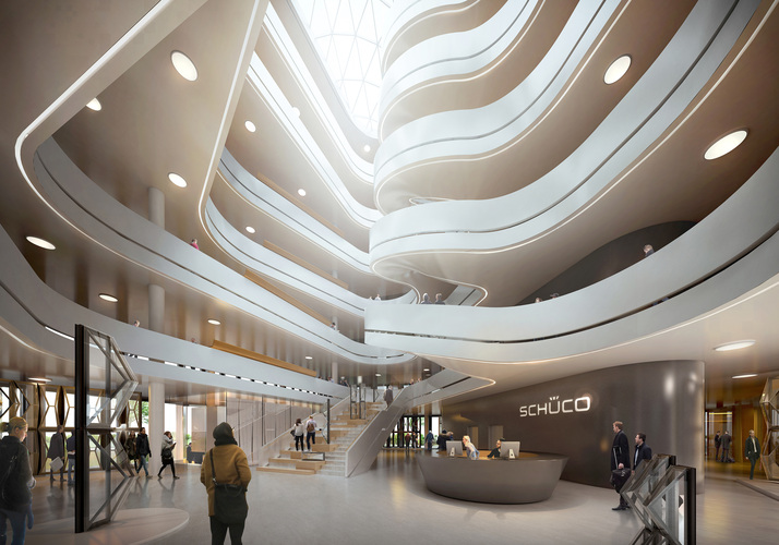 Das dynamische, über sämtliche Ebenen gestaltete Atrium ist architektonisches Highlight und zentraler Sammelpunkt des Gebäudes. Das Raumkonzept des Neubaus sieht eine offene kommunikationsfördernde Arbeitslandschaft vor, um den Dialog und Wissensaustausch der Mitarbeiter und Mitarbeiterinnen zu fördern. - Schüco - © Schüco
Das dynamische, über sämtliche Ebenen gestaltete Atrium ist architektonisches Highlight und zentraler Sammelpunkt des Gebäudes. Das Raumkonzept des Neubaus sieht eine offene kommunikationsfördernde Arbeitslandschaft vor, um den Dialog und Wissensaustausch der Mitarbeiter und Mitarbeiterinnen zu fördern. - Schüco - © Schüco