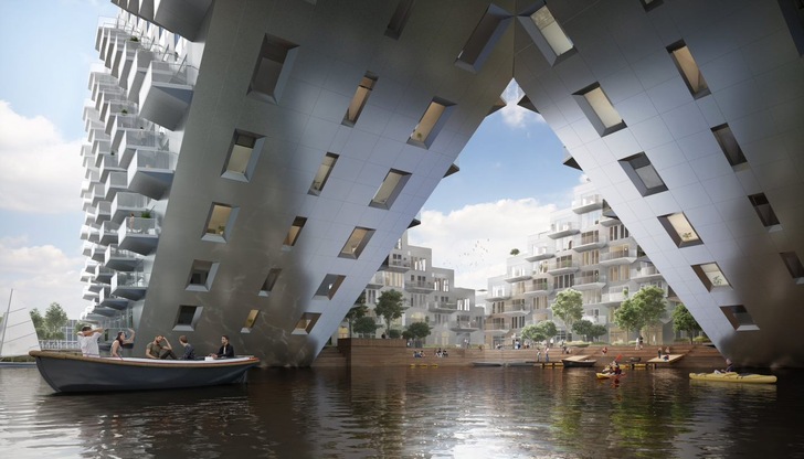 Einige der Wohnungen des „Sluishuis“ in Amsterdam IJburg sind stark geneigt über dem Wasser positioniert. - © Barcode Architects
