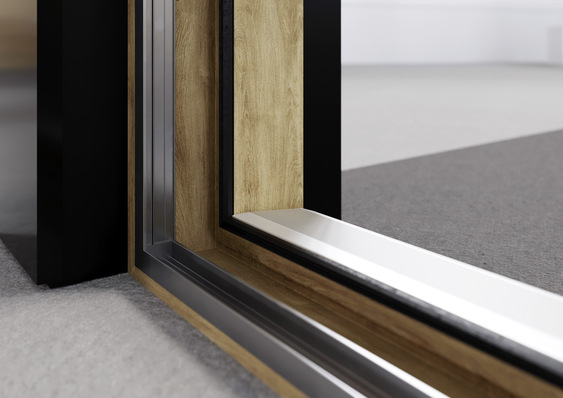 SYNEGO SLIDE ist mit einer pflegeleichten HDF-Oberfläche ausgestattet und bietet über 220 mögliche ­Varianten an Farbgebung und Oberflächen. Durch ­Aluminium-Vorsatzschalen der Reihe KALEIDO COVER und einen grauen Grundkörper lässt sich ein eleganter Aluminium-Look erzeugen, der sich mit den Vorteilen und Funktionalitäten polymerer Profile vereint.